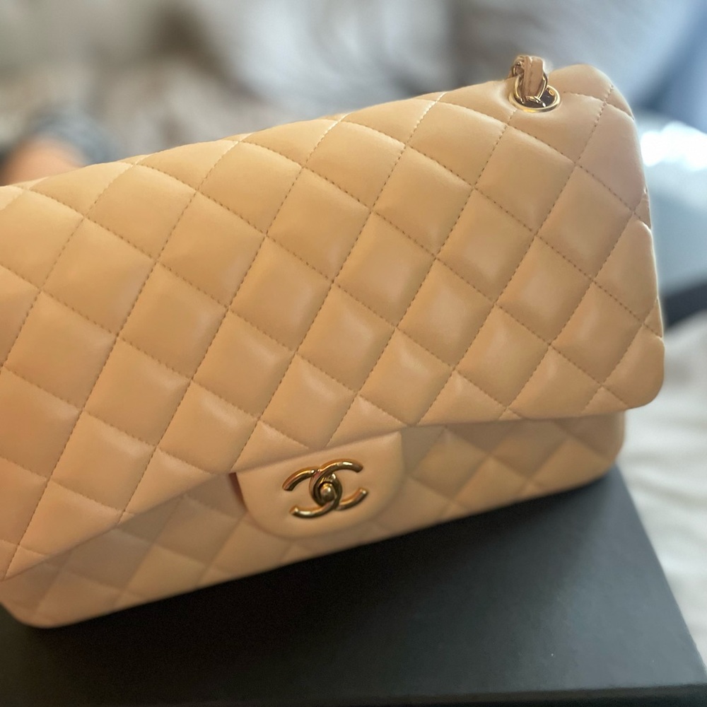 Brand new classic jumbo Chanel only used 1 time. Cream color
